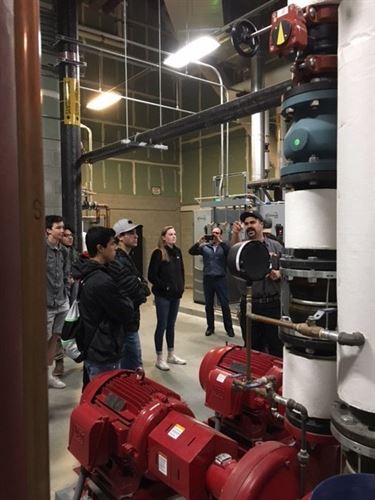 Students looking at building utilities