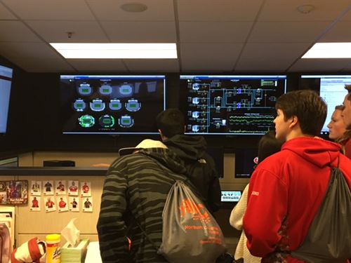 Students looking at monitors with scan images